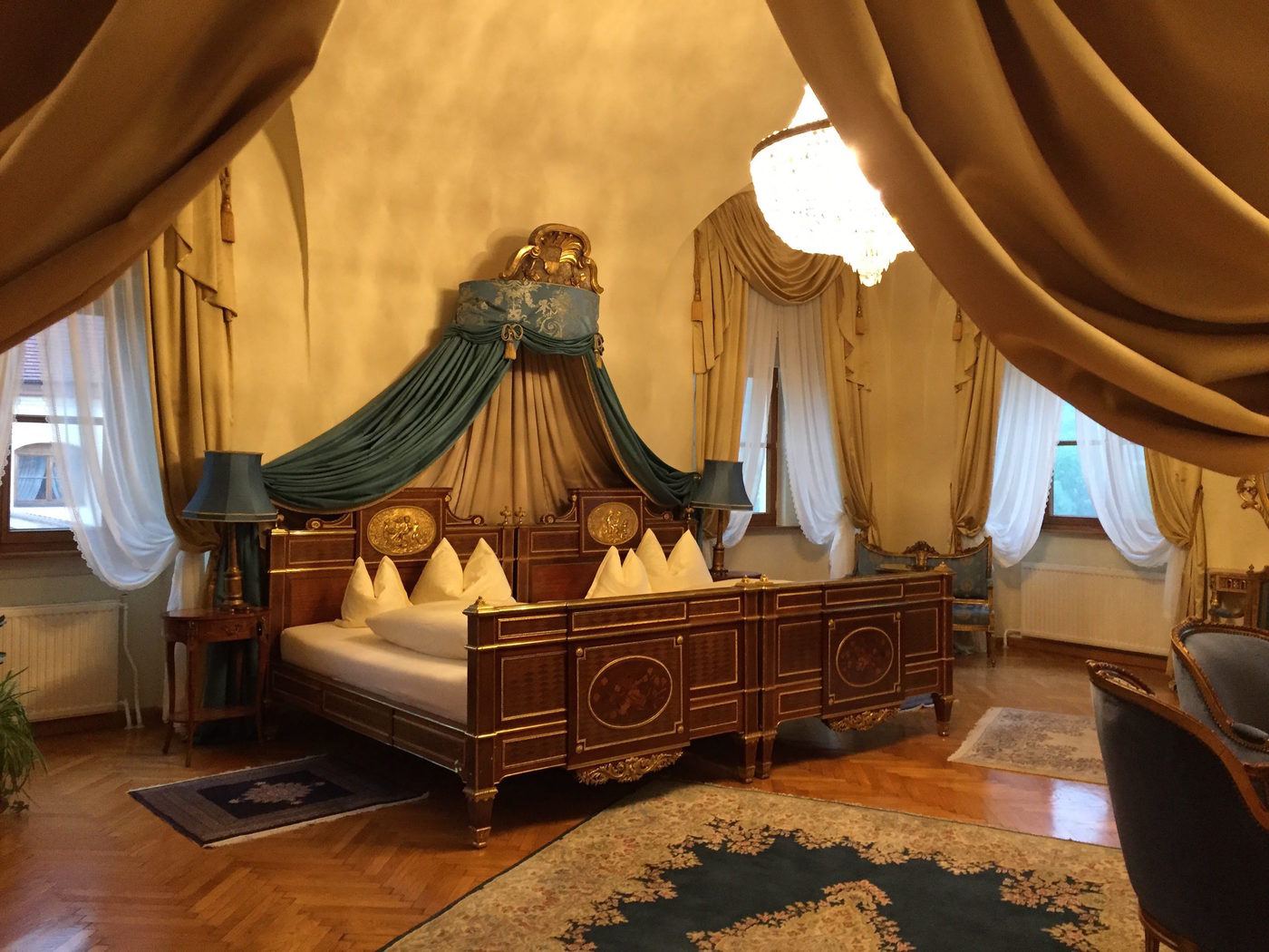 Enormous bedroom with high ceilings and a giant, double-double bed