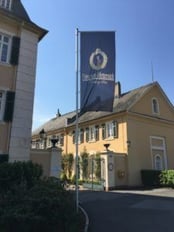 Exterior shot of Schloss Johannisberg with a flag