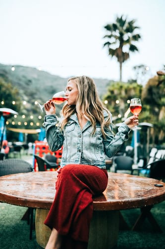 Woman tasting wine