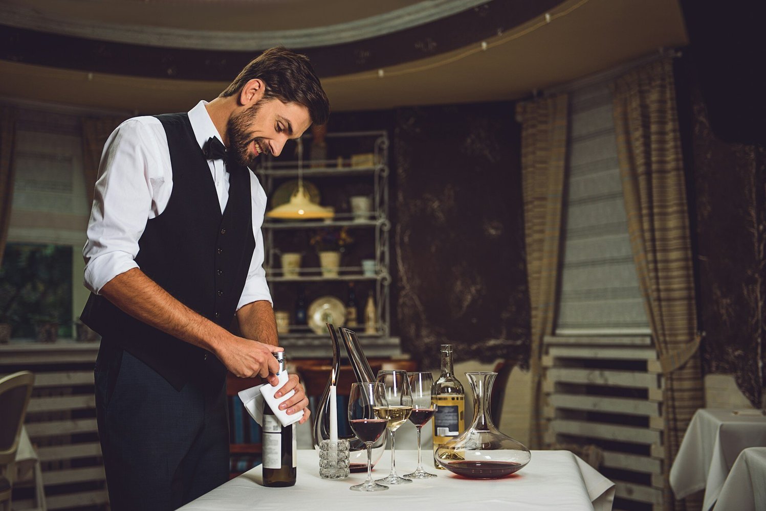 Man opening a bottle of wine